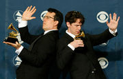 TMBG posing with their grammy awards for Boss of Me